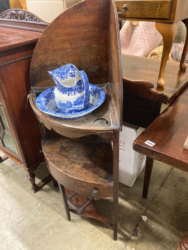 A George III corner washstand, width 62cm, depth 41cm, height 121cm together with a Spode blue and white jug and basin